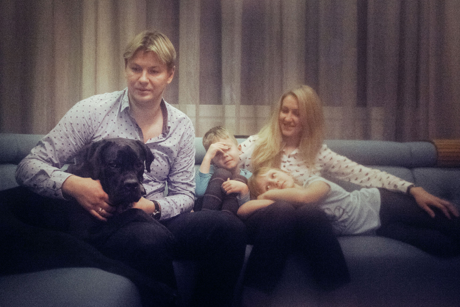 Rene and Bronislava relaxing with their children at home. Narva, Estonia.